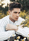 Young man holding flowers outdoors in a scene reminiscent of "The Last Leaf" diaries.