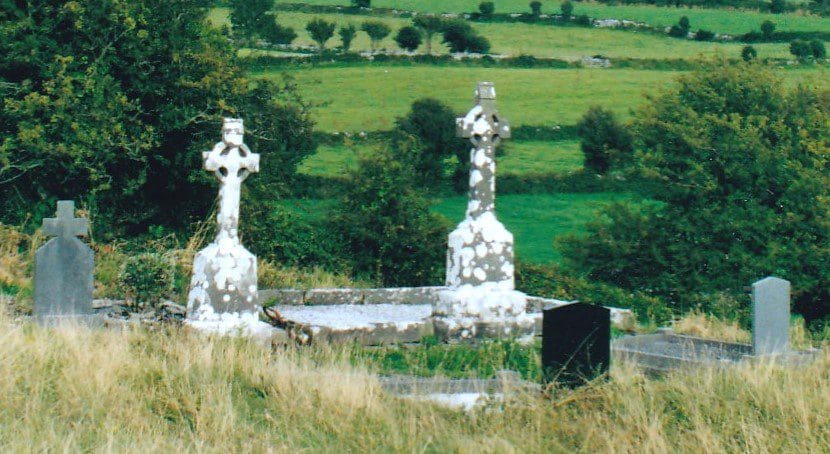 Celtic crosses in Galway with trees in the back