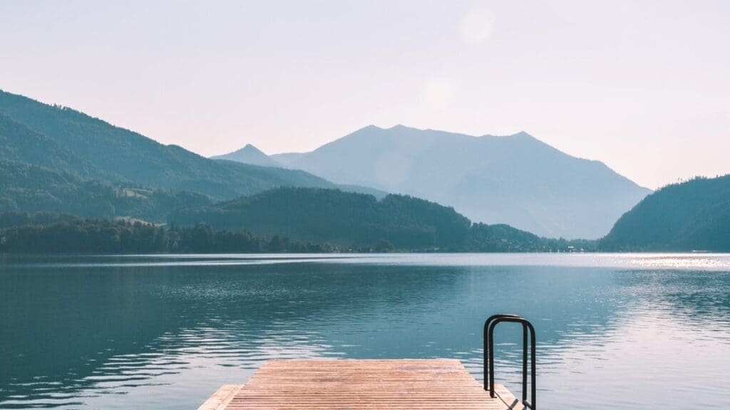 A dock with mountains in the background